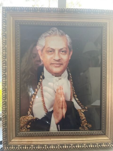 A photo frame of a guruji with a white background